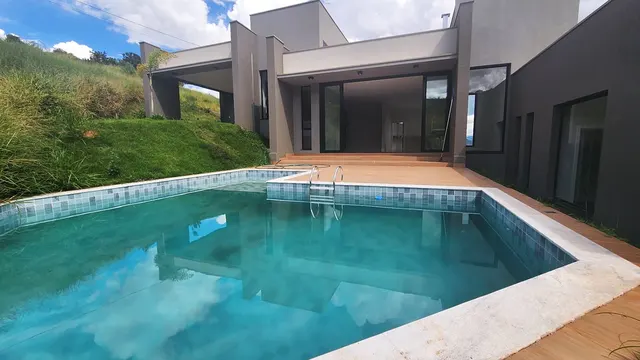 Foto 1 de Casa de alto padrão com 4 suítes e piscina em condomínio fechado, Condomínio Olhos D'Água