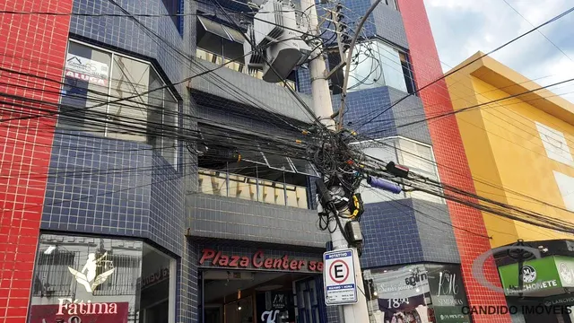 Foto 1 de Sala comercial com bancada e armários em galeria, Centro
